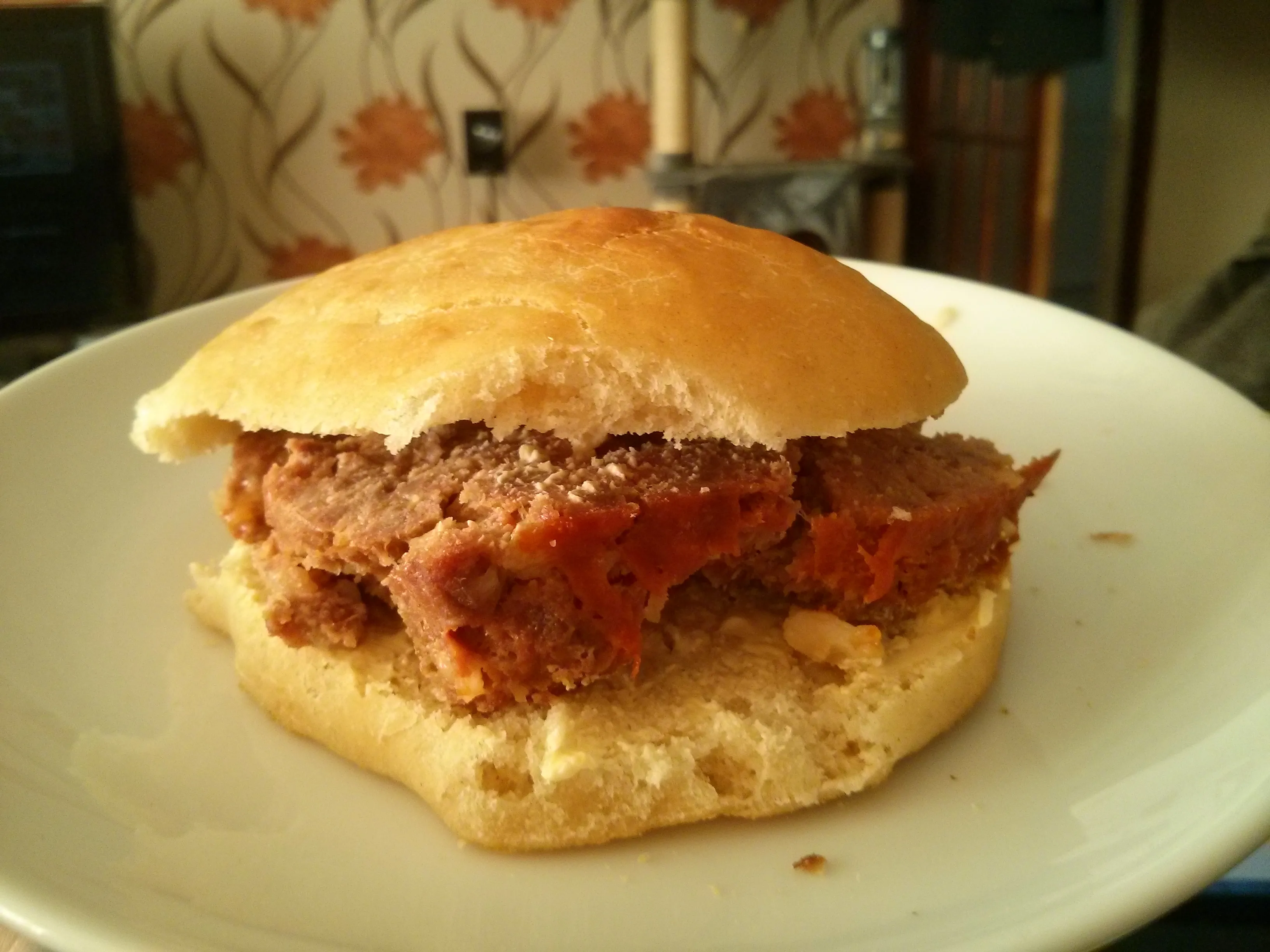 A slice of meatloaf in a bun